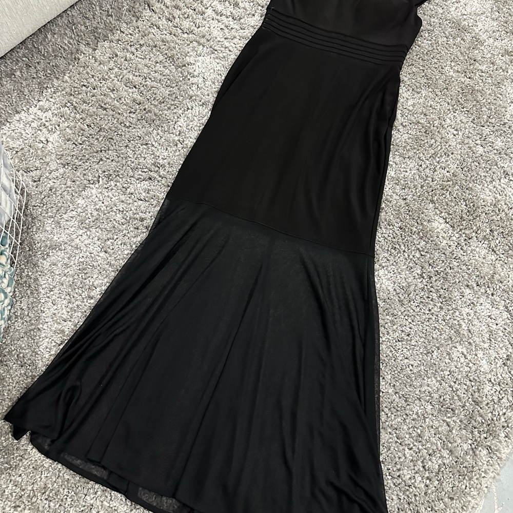 Long black formal dress with zipper at the back.